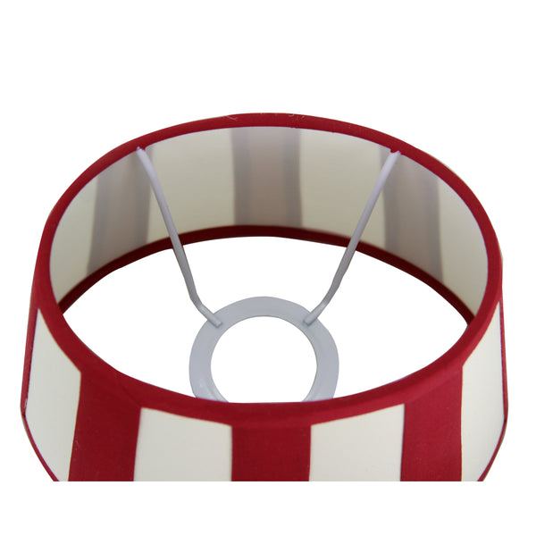Detailansicht des ovalen Lampenschirms in Rot und Creme. Modernes Design, das jedem Raum eine warme Atmosphäre verleiht.