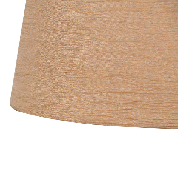 Detailaufnahme des ovalen Lampenschirms in Creme und Gold, der modernen Eleganz in jeden Raum bringt.
